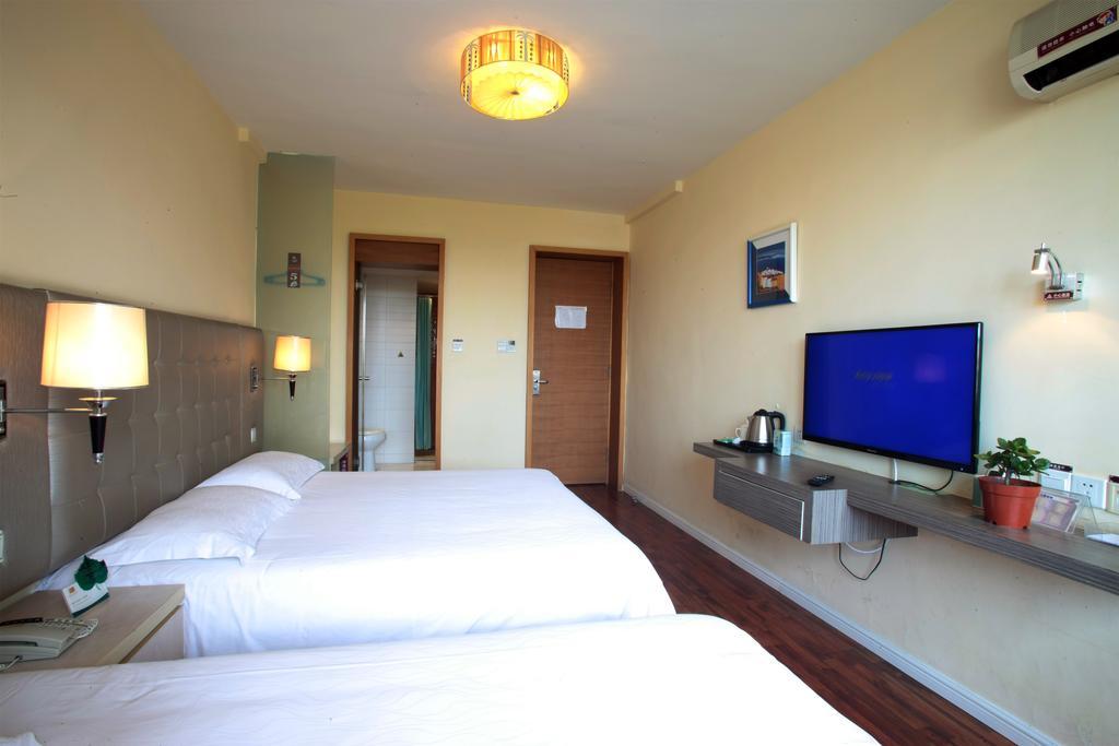 Qingdao Renjia Bussiness Hotel Esterno foto