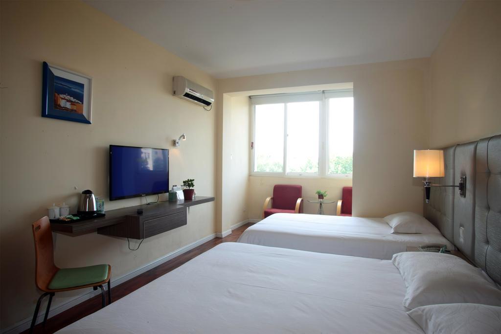 Qingdao Renjia Bussiness Hotel Esterno foto